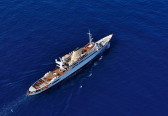 Aerial shot of luxury superyacht Christina O sailing deep blue water 