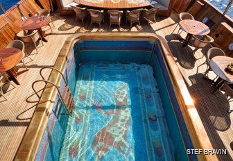 close up of Christina O's mosaic decorated swimming pool and beach club