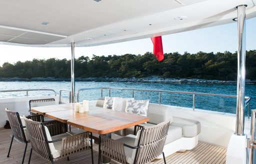 Exterior dining area onboard charter yacht ANTHEYA III